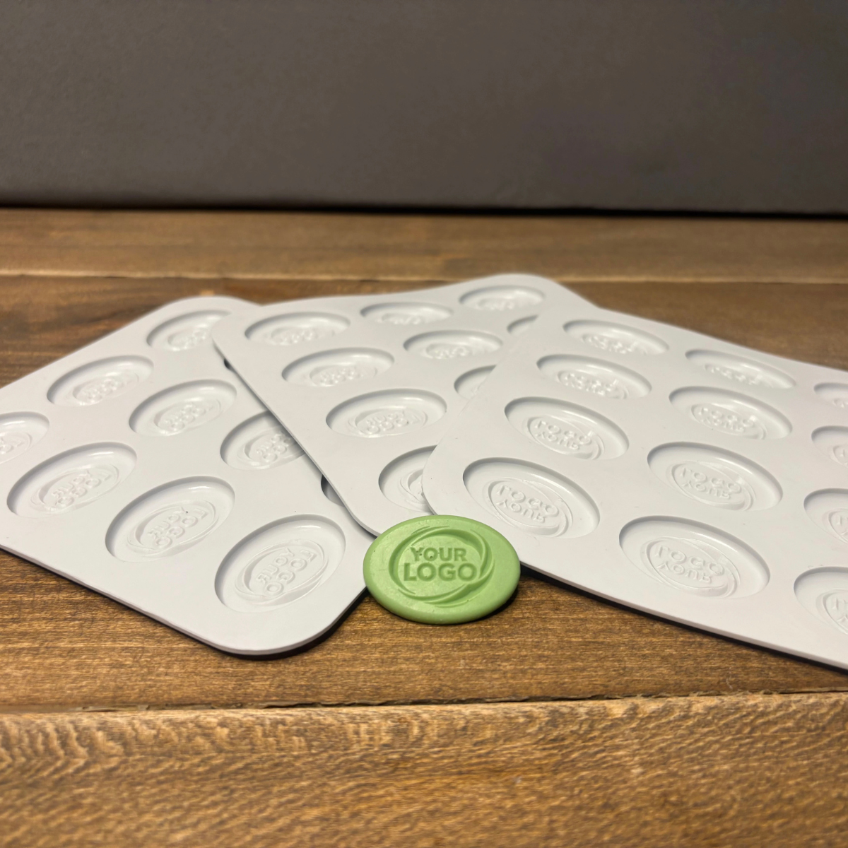 Food-grade custom oval silicone mold displayed with the finished branded product