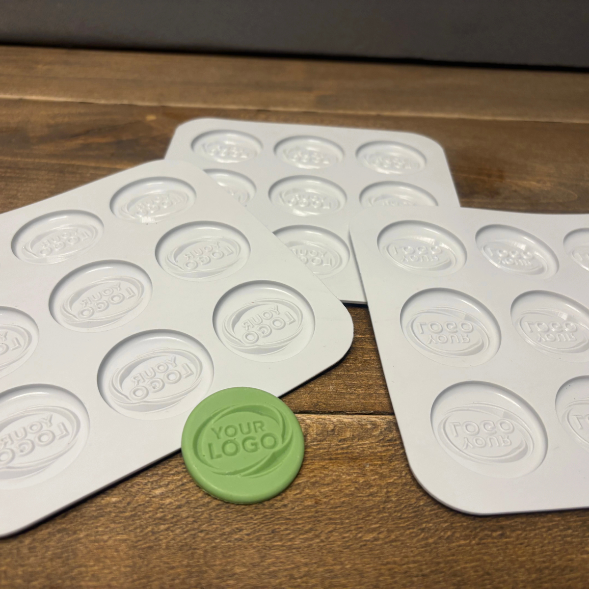 Custom round silicone mold trays with finished branded product