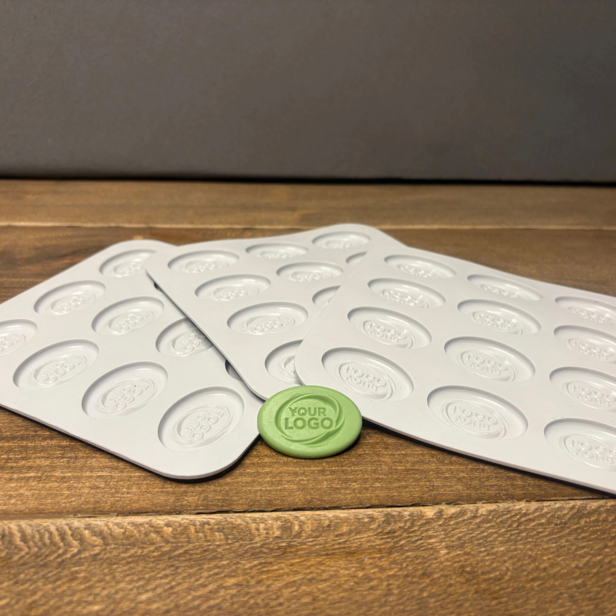 Food-grade custom oval silicone mold shown with the finished branded product