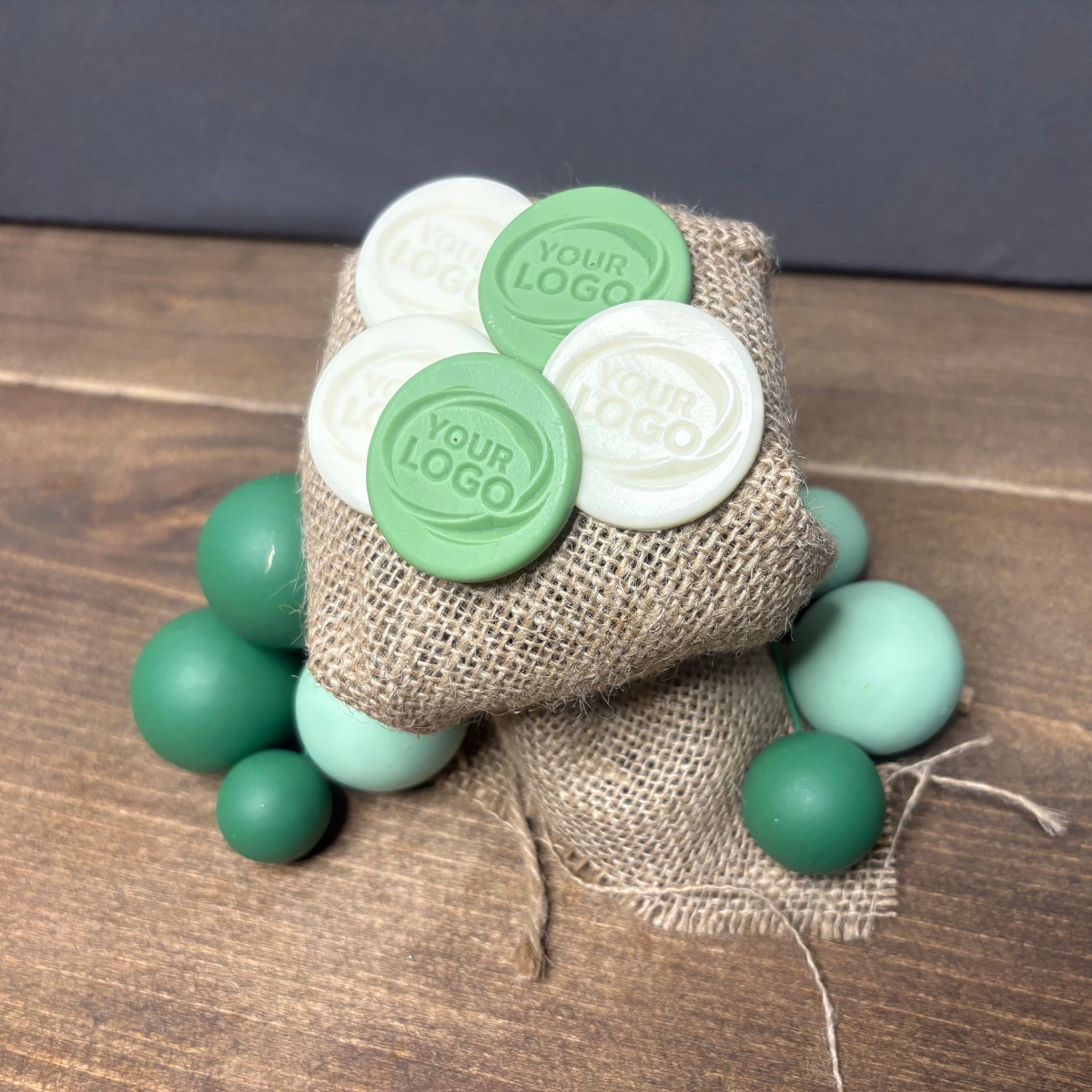Green and white round products with an embossed company logo
