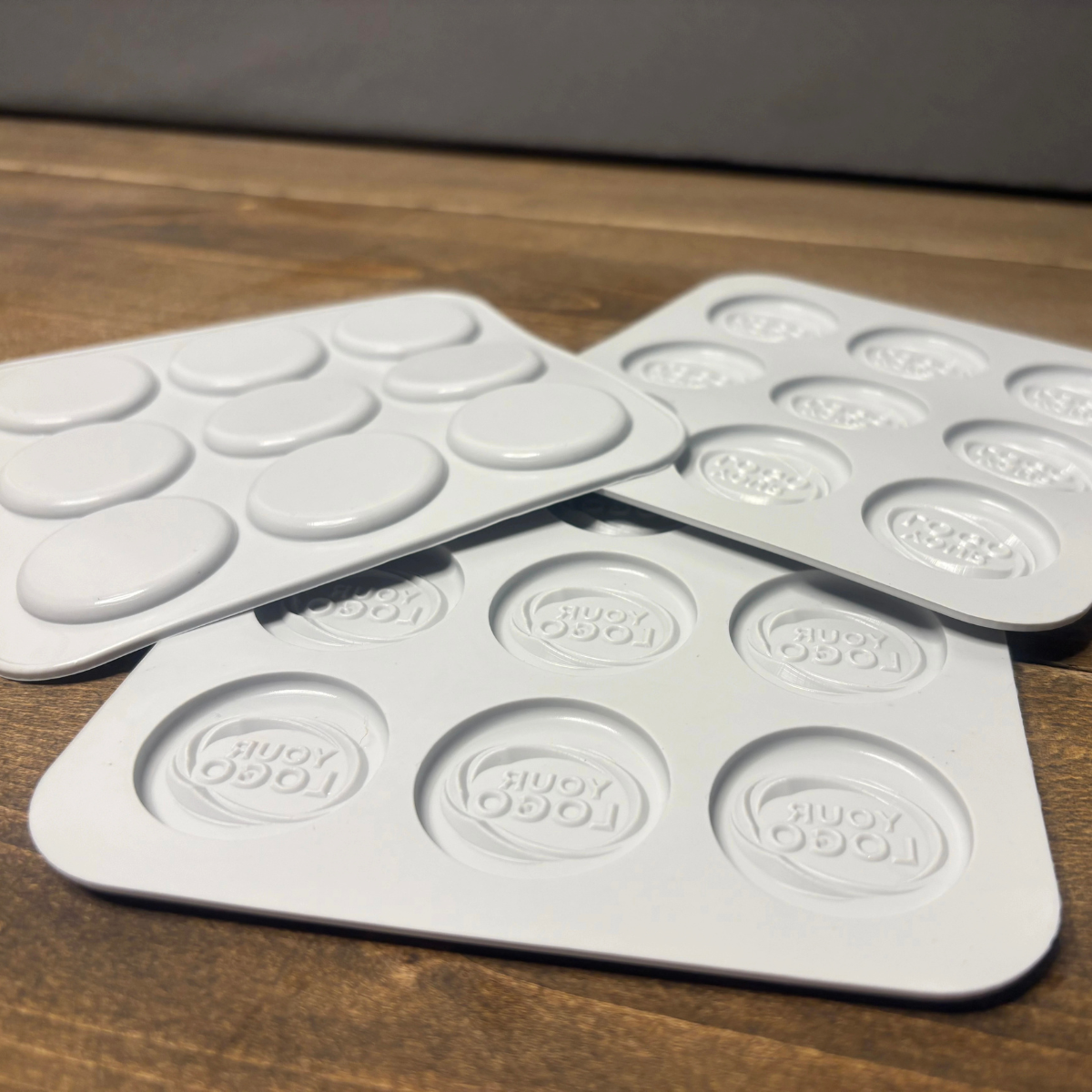 Front and back view of custom round silicone mold trays
